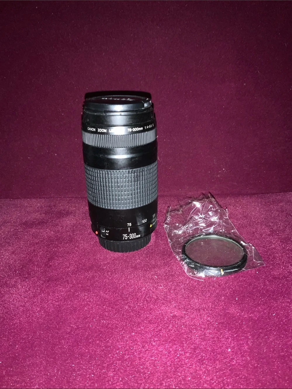 Canon Black 75-300mm f/1.4-5.6 ll Telephoto Zoom Lens with covers. Good cond.